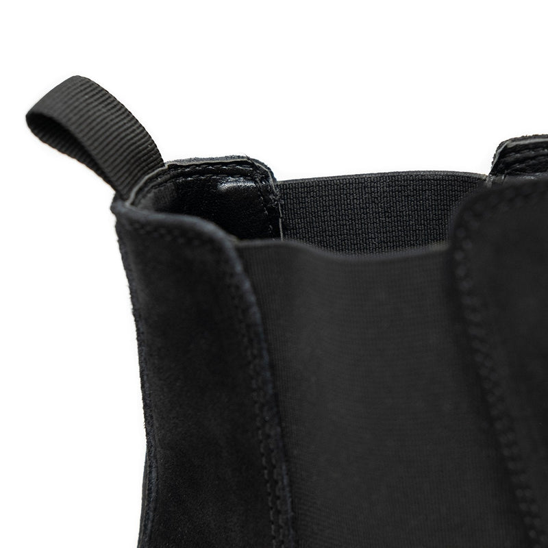 Walk London Darcy Star Chelsea Boot in black suede, close-up shot of the pull tab with white background