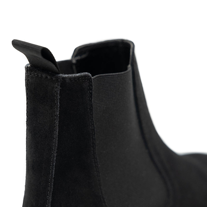 Walk London Darcy Star Chelsea Boot in black suede, close-up shot of the back with white background