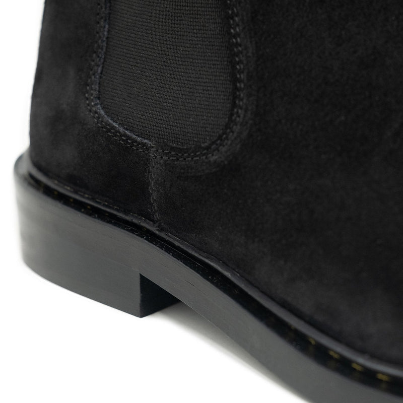 Walk London Darcy Star Chelsea Boot in black suede, close-up shot of the heel with white background